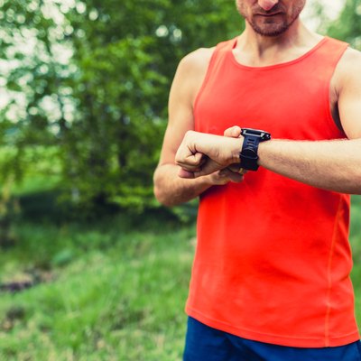 Runner looking at sport smart gps watch