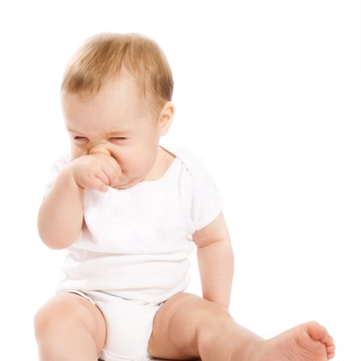Babys scratching his nose
