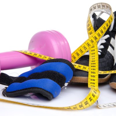 Pink dumbell, ankle weights and fitness shoes
