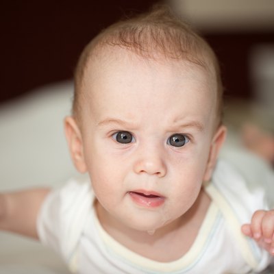 Drooling baby with artful face