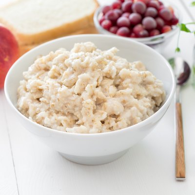 Healthy breakfast: oatmeal porridge and fruits