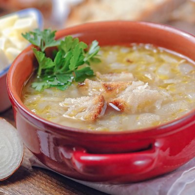French onion soup in a red bowl