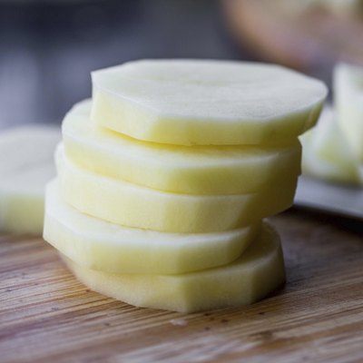 Stack of sliced purified potatoes, cooking delicious dishes