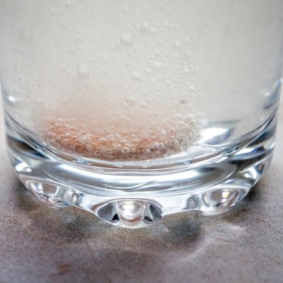Effervescent/Fizzing Tablets/Pills in a Glass of Water