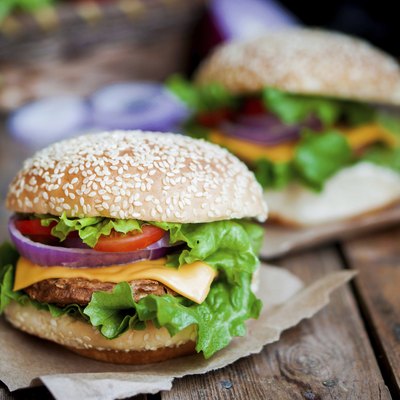 Closeup of home made burgers on wooden background