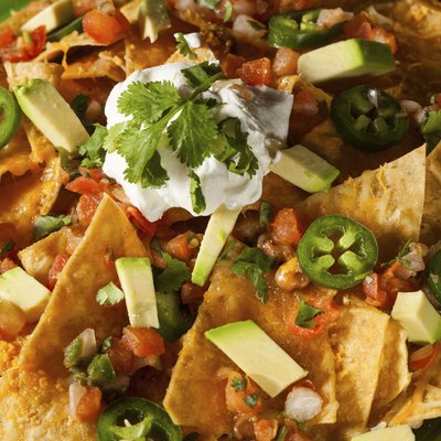 Homemade Unhealthy Nachos with Cheese and Vegetables
