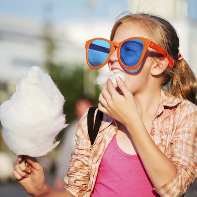 Girl eating cotton candy