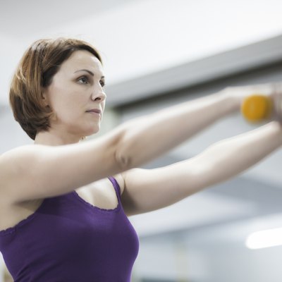 Beautiful woman exercising pilates