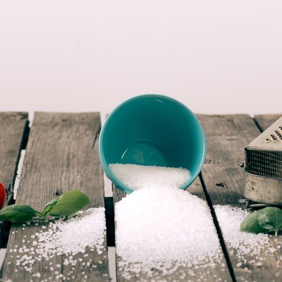 Spilled salt on a wooden table