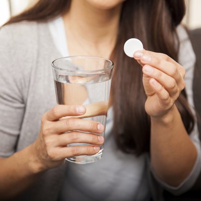 Woman taking an antacid