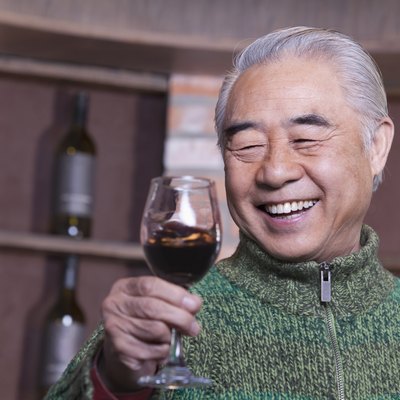 Senior Man Holding Wineglass, Portrait