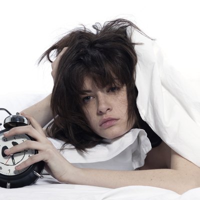 woman in bed awakening