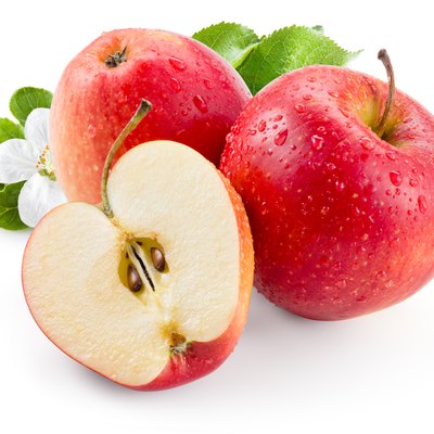 Red apple. Fruit with drops and leaves. With clipping path