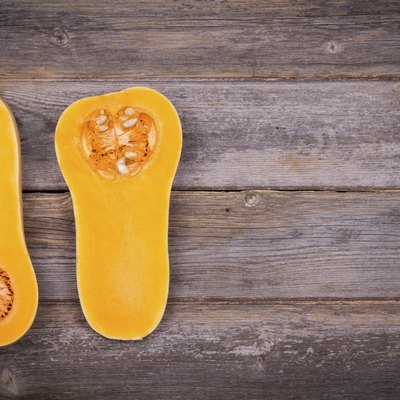 Sliced butternut squash on wood