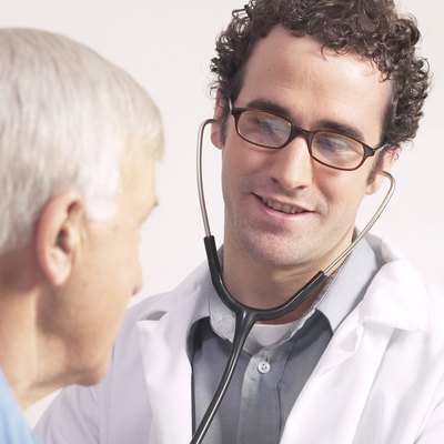 Doctor listening to heartbeat