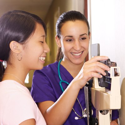 Nurse weighing teenage girl