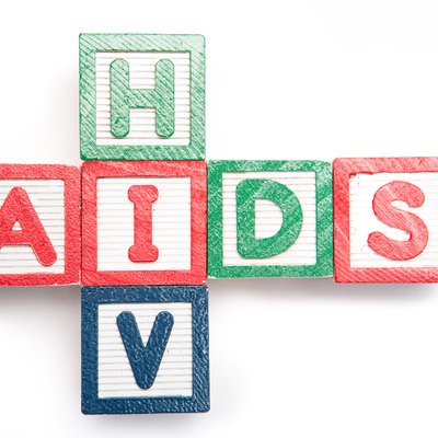 Wood blocks spelling aids and hiv in a cross shape on its side