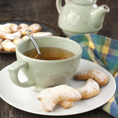 Crescents vanilla almond cookies and cup of green tea