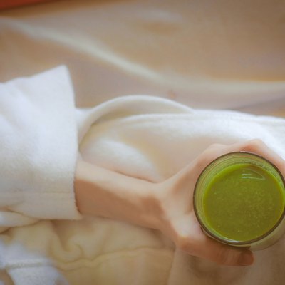 Ariel green smoothies on health spa white robe