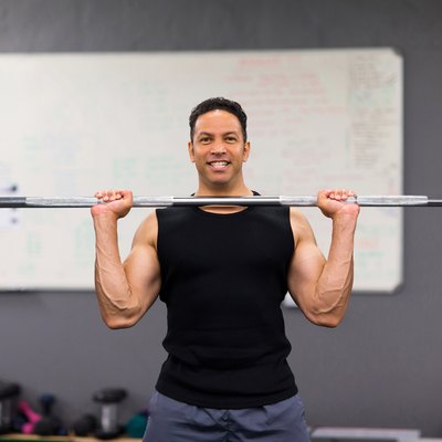 muscular man lifting weights