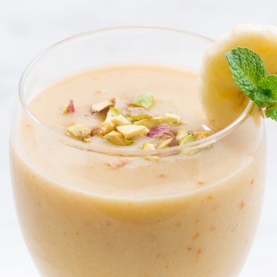 banana smoothie in a glass, closeup