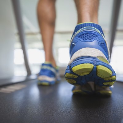 Low section of a man running on treadmill