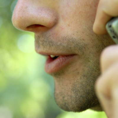Close-up of a man talking on a mobile phone