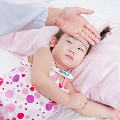 Sick little girl nursed by a pediatrician