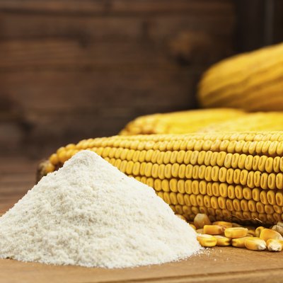 Domestic corn flour arranged with maize cob