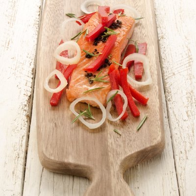 grilled salmon fillet on wooden board