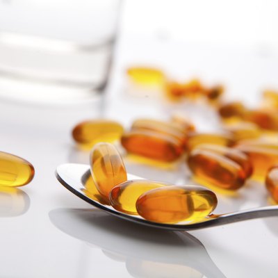 Vitamin fish oil capsule isolate on white background