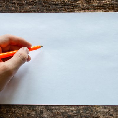 lefty writes with a ballpoint pen International Lefthanders Day