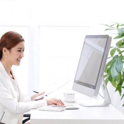 Young business lady using computer