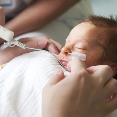 Newborn baby in incubator