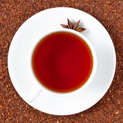 White cup of red rooibos South African tea with star