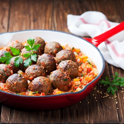 Meatballs with vegetable sauce in cast iron skillet