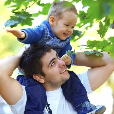 father and son having fun playing outdoors