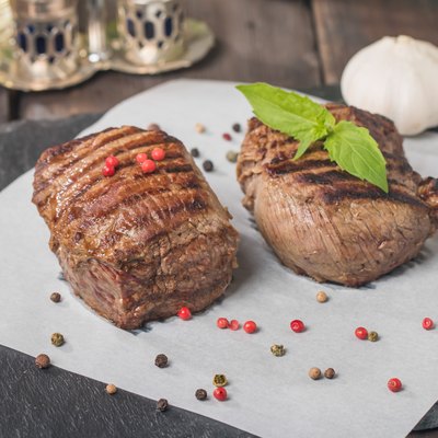 Grilled beef steak close up on paper
