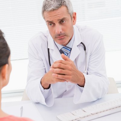 Patient consulting a serious doctor
