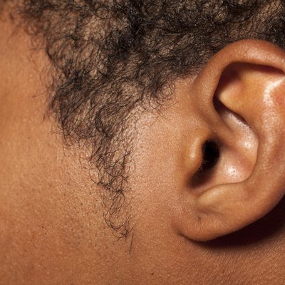 Ear of a dark-skinned young man
