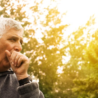 Coughing senior man.