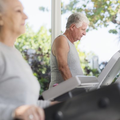 senior man exercising in wellness club