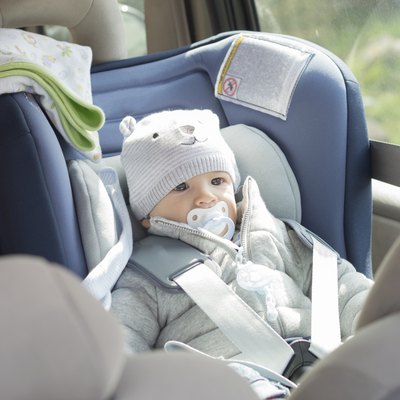 Baby boy in his child safety car seat