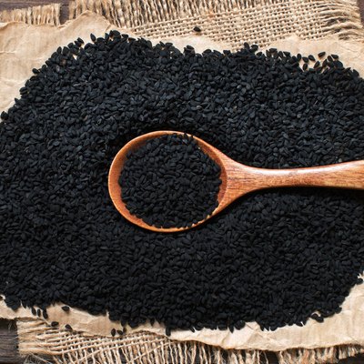 Nigella sativa or Black cumin with a spoon