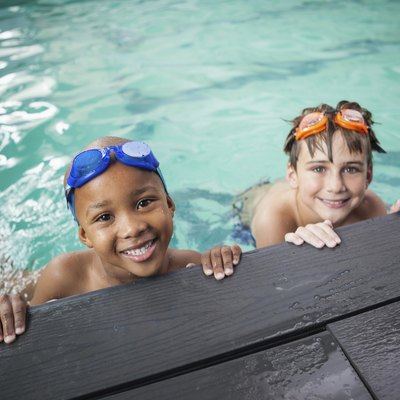 Little boys smiling in the pool