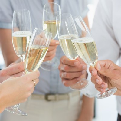 Hands toasting with champagne