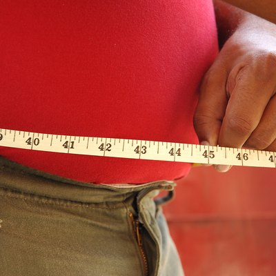 A person measuring waist, Side view
