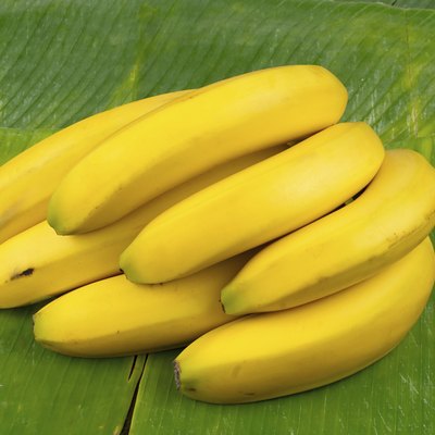 perfect yellow bananas on a banana leaf