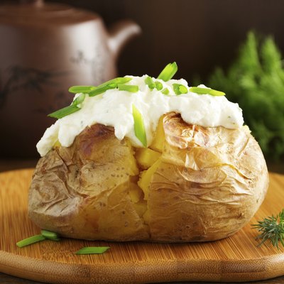 Baked potato with cream of the cream cheese closeup.