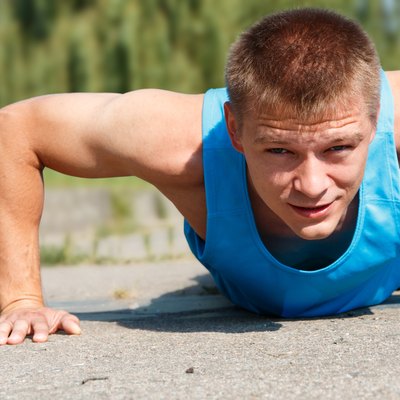 Man doing push-up while outdoor training